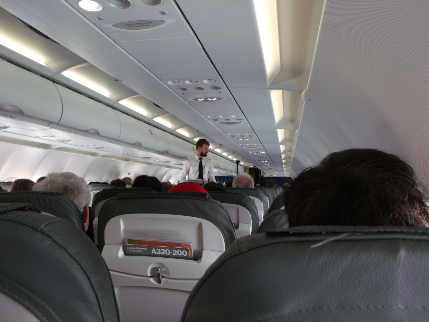 FLIGHT ATTENDANTS ARE PROVIDING HAND SANITIZER